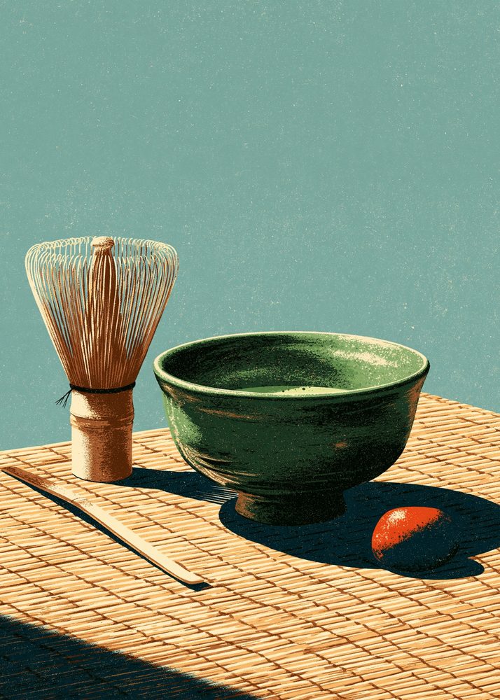 A matcha bowl and whisk on a wooden table
